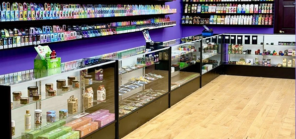 Vape Store Interior with Displayed Products and Colorful Packaging on Shelves